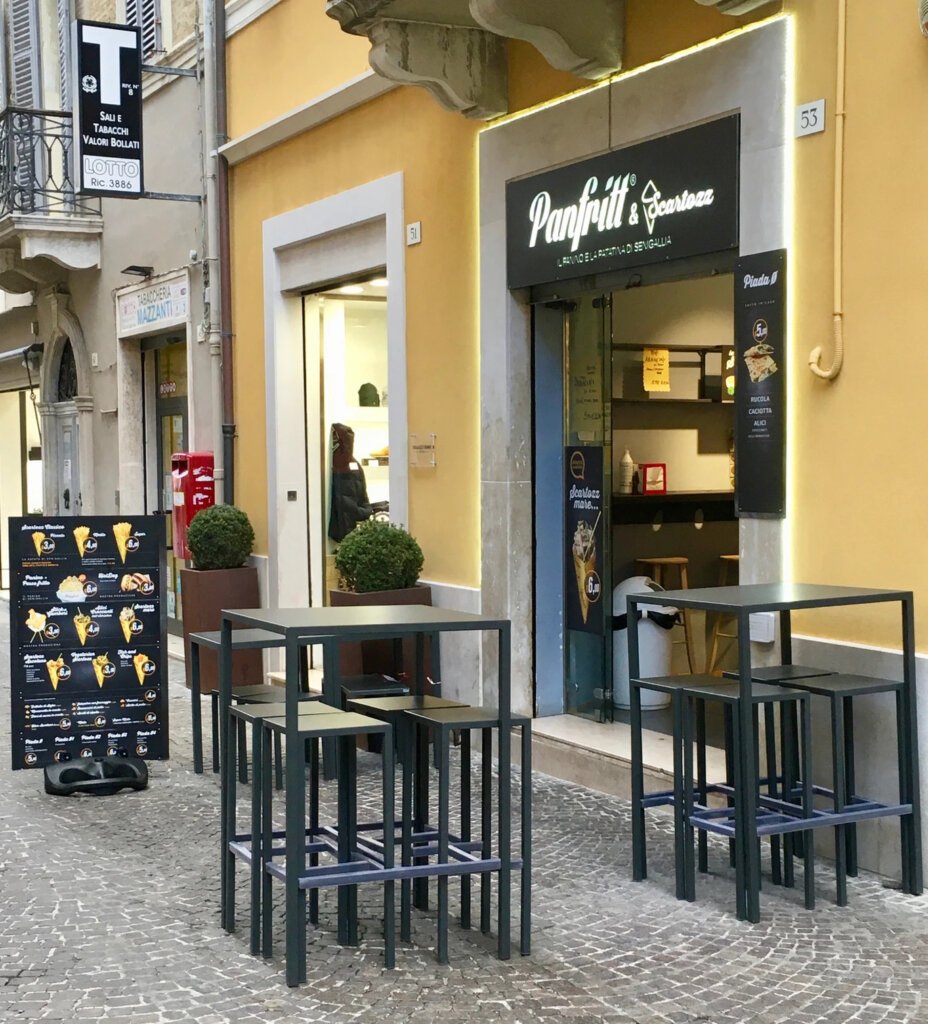 Panfritt's Scartozz, a French fry shop in Italy, with outdoor seating and menu board.